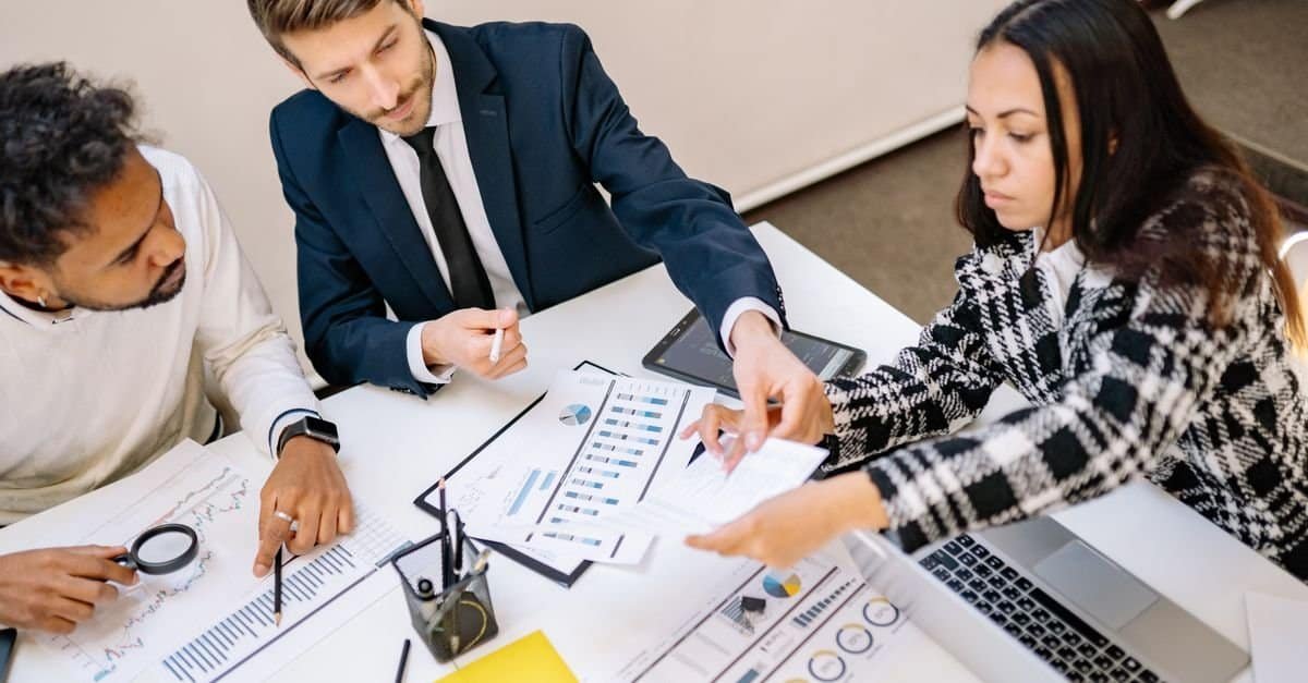 Business team reviewing an AI implementation checklist